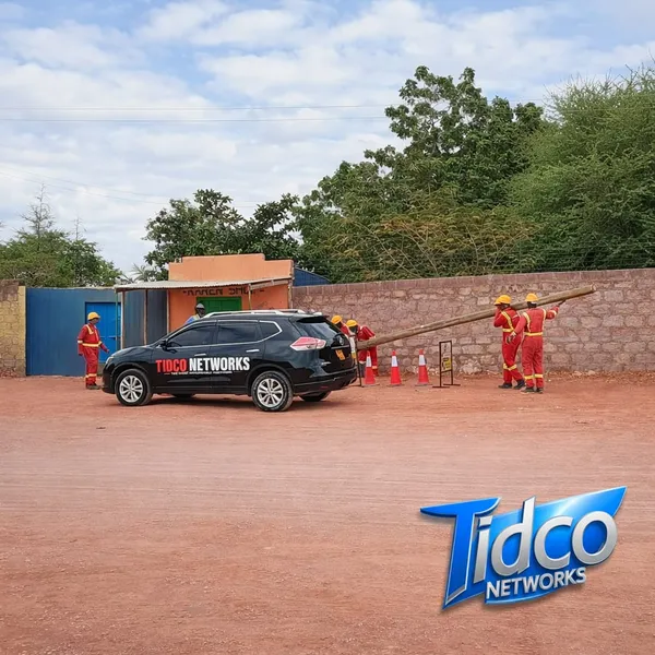 Tidco Networks installation team erecting a pole